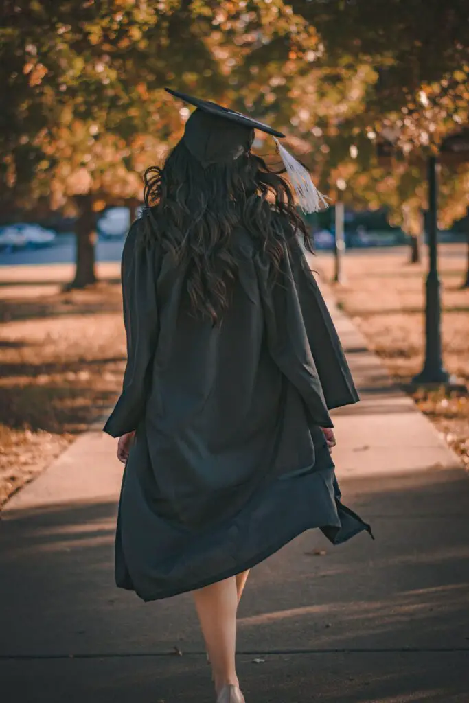 female student in cap and gown