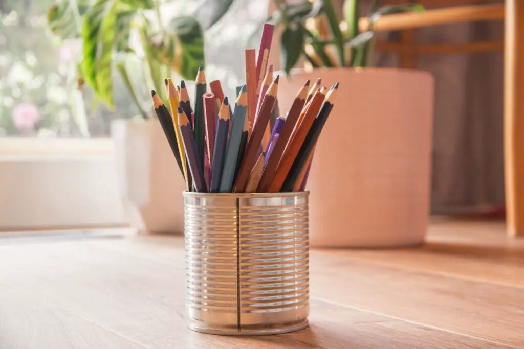 a tin can with colored pencils, symbolizing the many skills needed by students to budget successfully